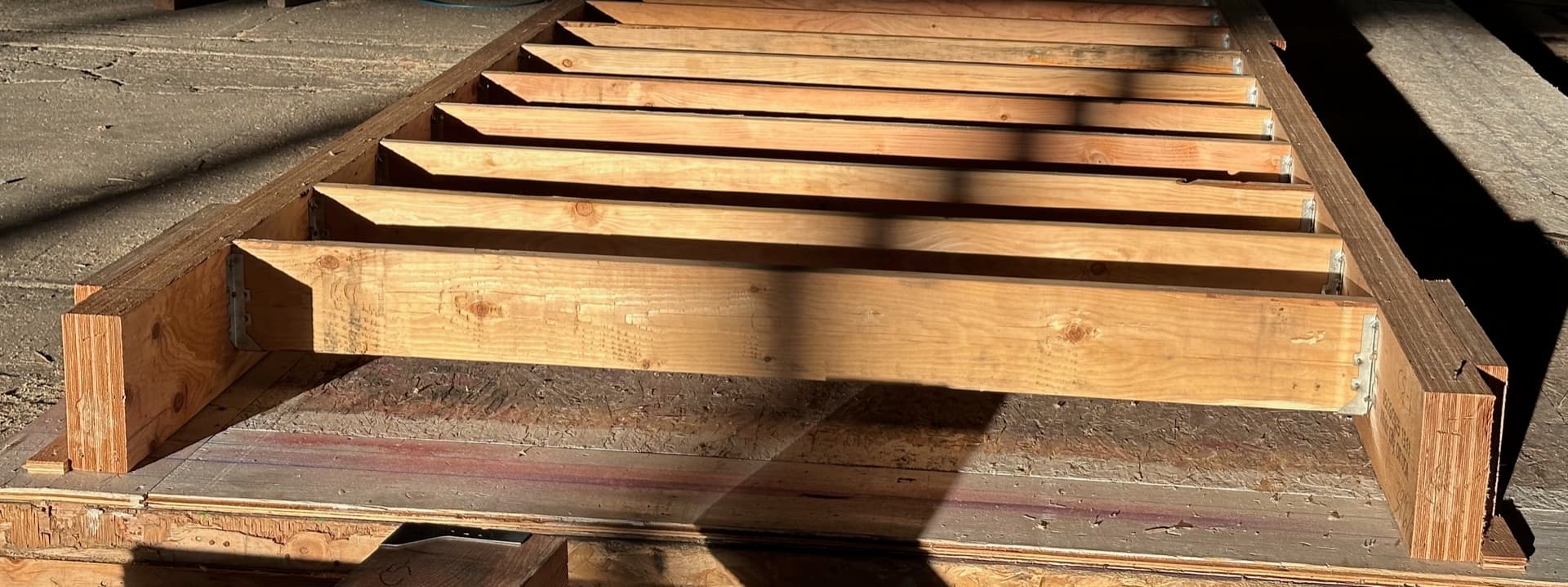 Close-up of evenly spaced wood joists in a floor cassette