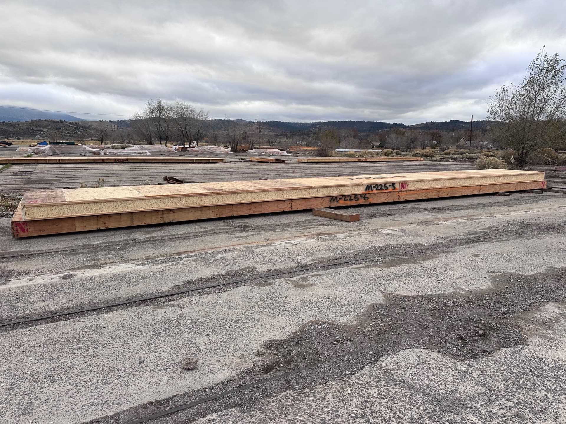 Long cassette panels staged in yard on overcast day