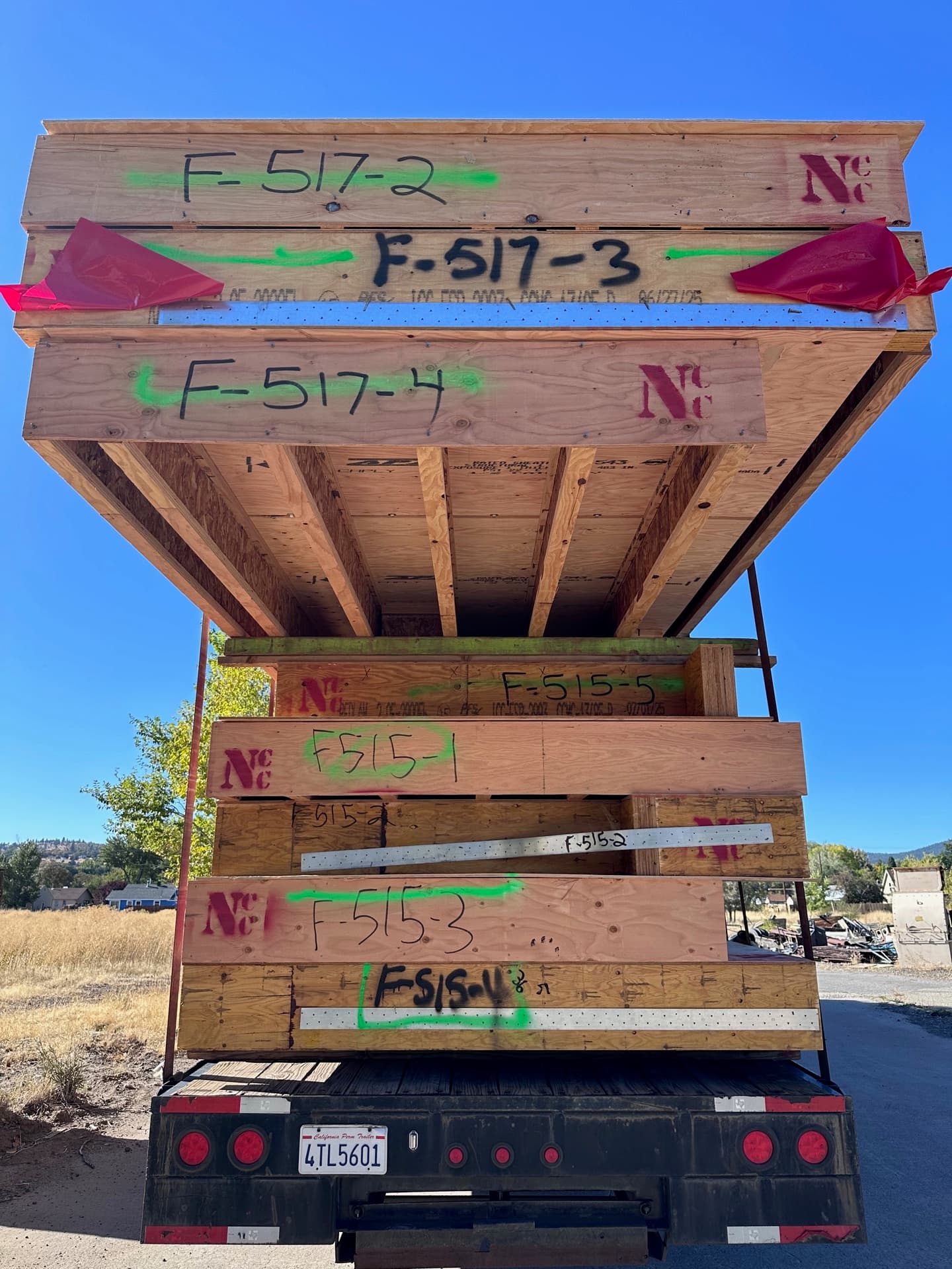 Rear view of NCC-branded trailer stacked with floor cassettes