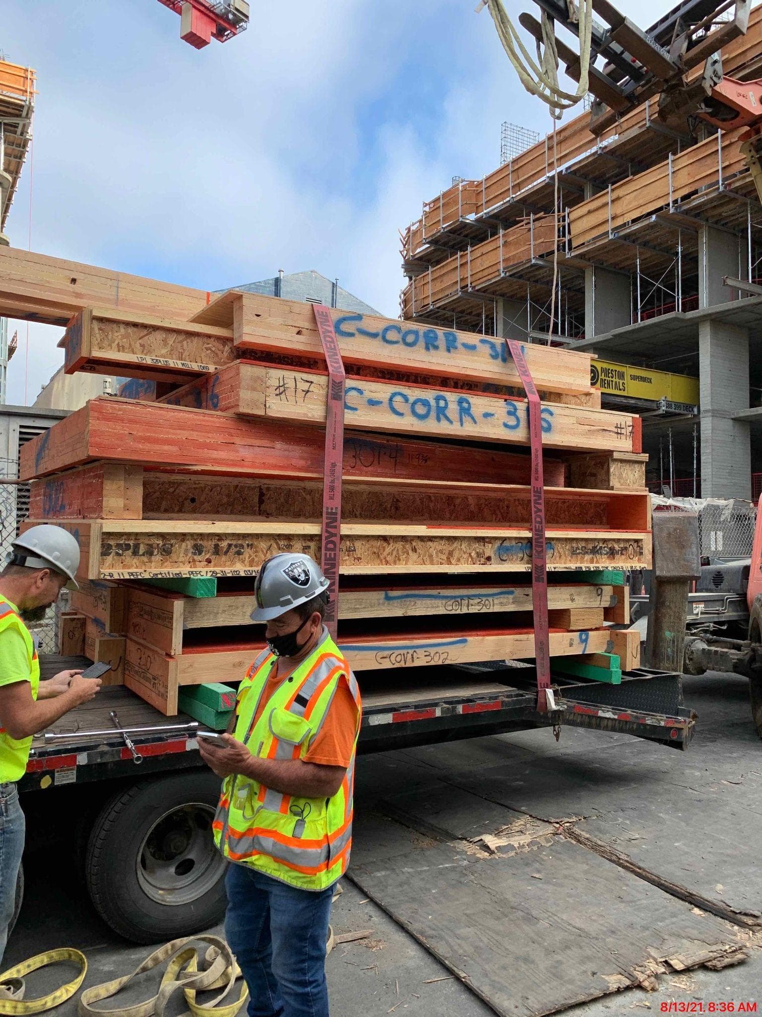 NCC team members on site reviewing panel delivery
